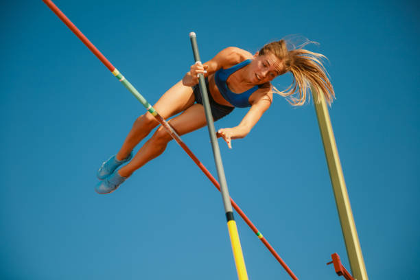 istock Female high jumper training at the stadium in sunny day 1158384503