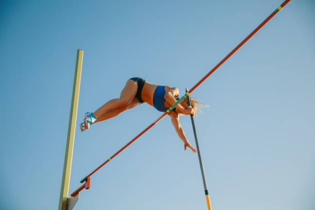 istock Female high jumper training at the stadium in sunny day 1158384504