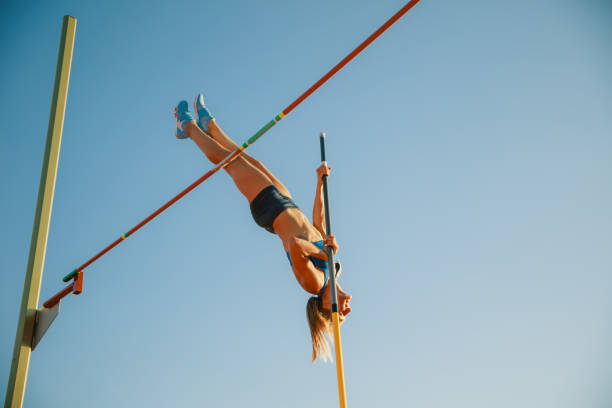 istock Female high jumper training at the stadium in sunny day 1158384506