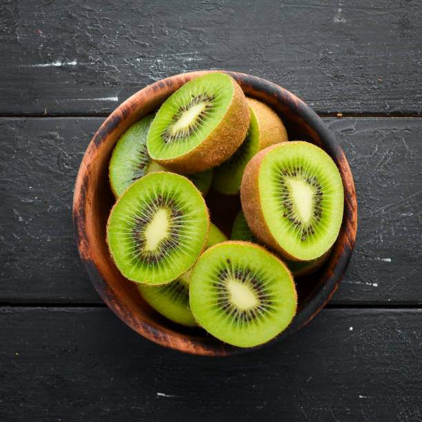 istock Fresh Kiwi on a black background. Top view. Free space for your text. 1158384585