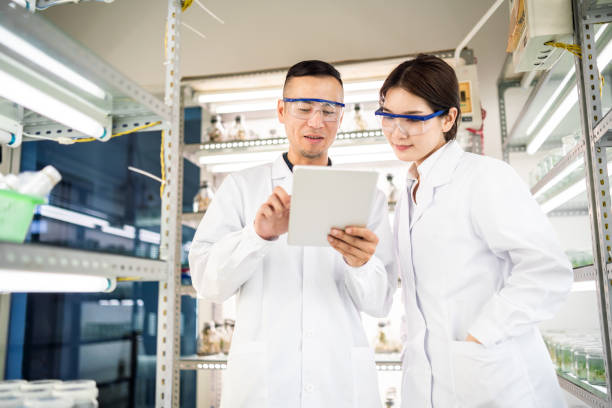 istock Asian scientists using a digital tablet in an agricultural laboratory 1158386989