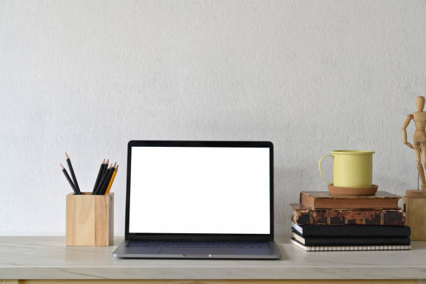 istock Loft workspace with blank white screen laptop and creative gadget. 1158387506