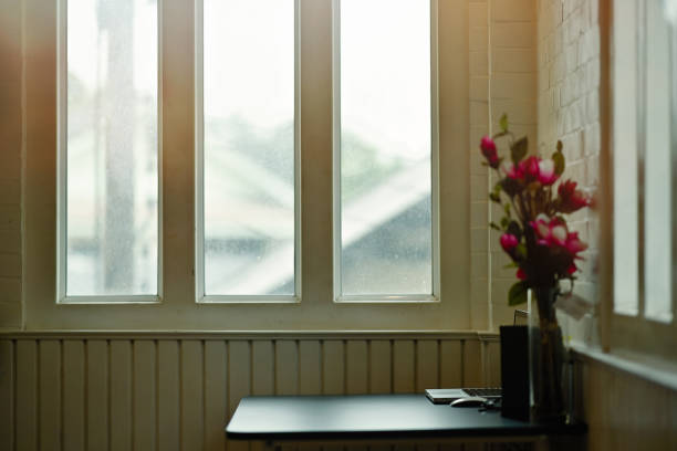 istock Workspace laptop with office supplies and window light. 1158389376