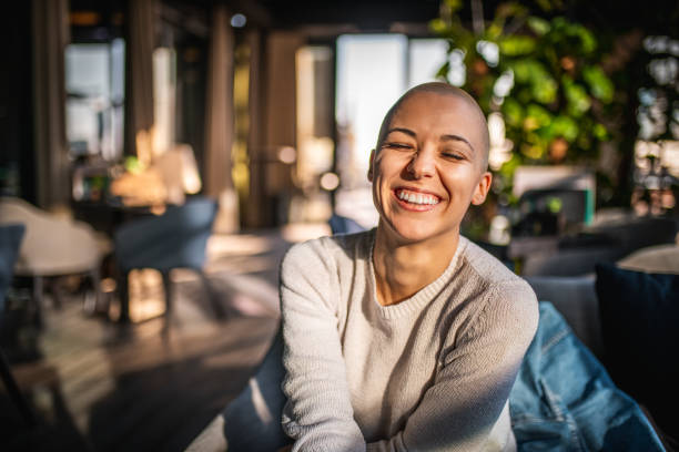 Portrait of a smiling girl with short hair Portrait of a smiling girl with short laughing with her eyes closed candid stock pictures, royalty-free photos & images