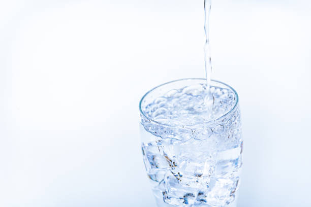 istock Pouring water into a glass 1158391093