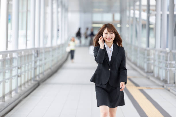 istock Business woman walking while calling 1158392791