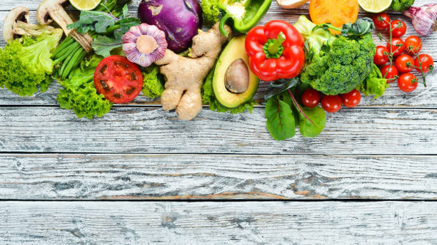 istock Fresh raw vegetables on a white background Wooden. Top view. Free space for your text. 1158392896