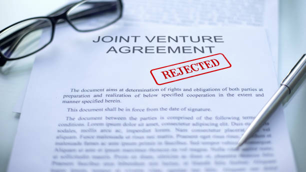istock Joint venture agreement rejected, seal stamped on official document, business 1158394543