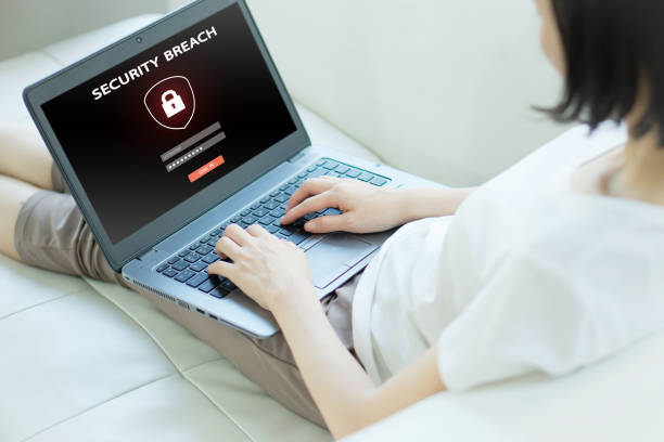 istock Hand tying laptop computer with password login on screen, cyber security concept 1158394571