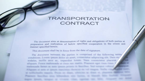 istock Transportation contract lying on table, pen and eyeglasses on official document 1158394710