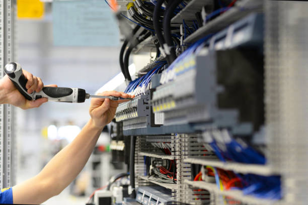 istock assembly components and cables in a factory in a control cabinet - workplace industry with future - closeup with hand and tools 1158396392