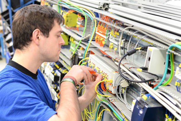 istock young apprentice worker in an industrial company assembling electronic components in the mechanical engineering of a modern factory 1158397365