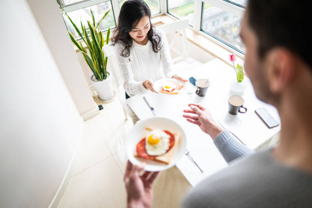 istock Her favorite eating from her favorite man 1158402724