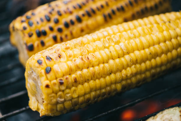 istock close up of yellow corn with crust grilling on barbecue grid 1158402865