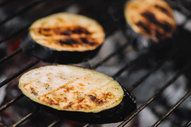 istock selective focus of eggplant slices grilling on barbecue grid 1158403194