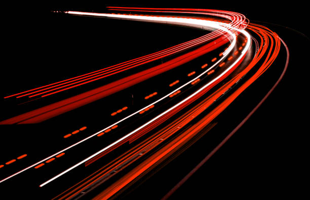 istock lights of cars with night 1158405521