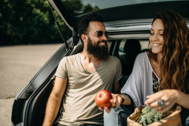 istock Young couple packing groceries 1158406117