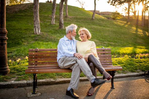 istock Senior couple relaxing at the park. 1158406462
