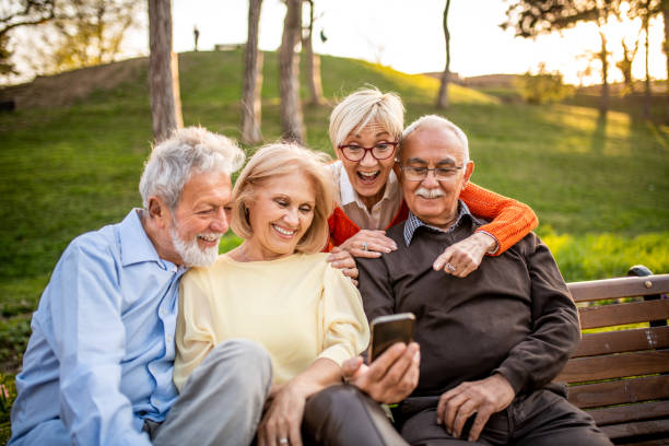 istock Group of seniors using mobile phone 1158407154