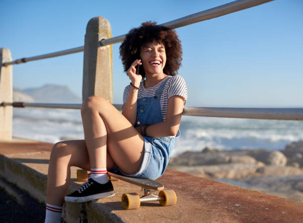 istock Happy smiling woman using phone 1158408758