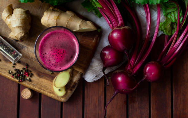 Fresh spicy beetroot juice with Ginger, flat lay stock photo