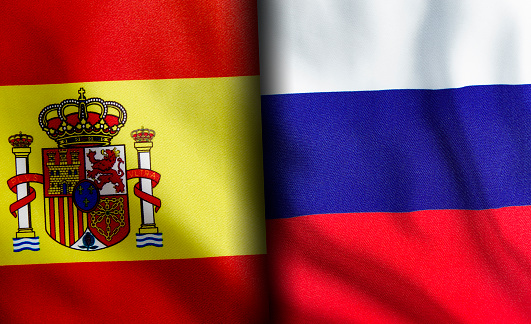 Spanish and Russian flags standing side by side