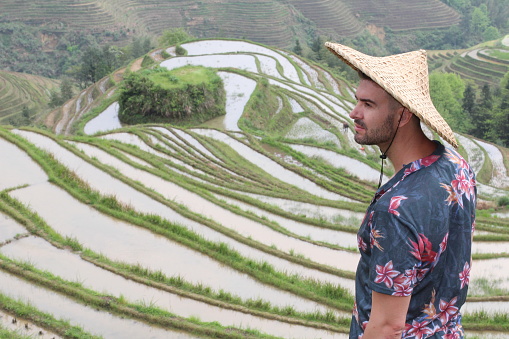 Tourist in traditional rice plantation.