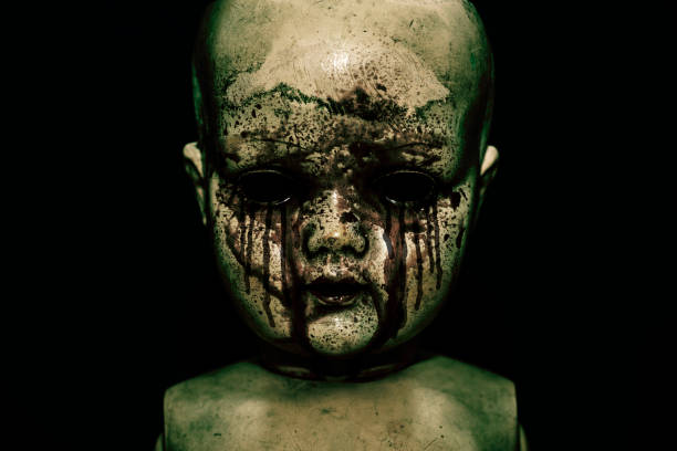 Creepy bloody doll in the dark Creepy bloody doll in the dark creepy doll stock pictures, royalty-free photos & images
