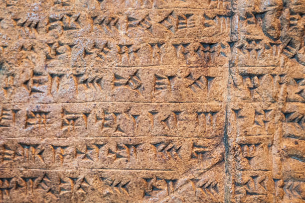 istock Ancient Assyrian and Sumerian cuneiform writing carving on stone from Mesopotamia. 1158422484