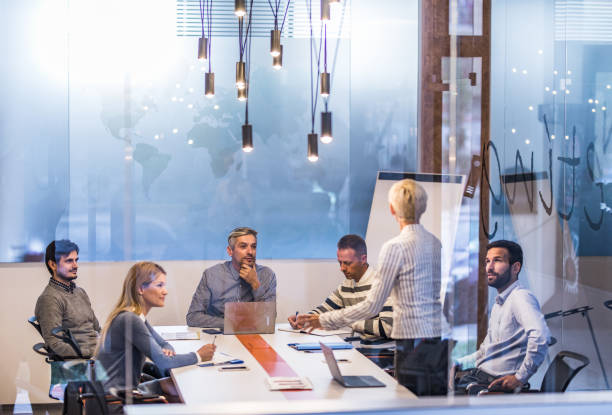 istock Business team talking while having a  meeting in board room. 1158422487