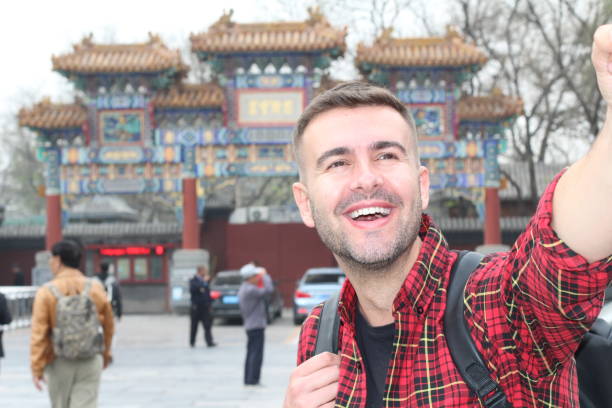 istock Happy man vacationing in Asia 1158424528