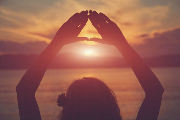 istock Young woman practicing yoga on the sandy beach. 1158424535
