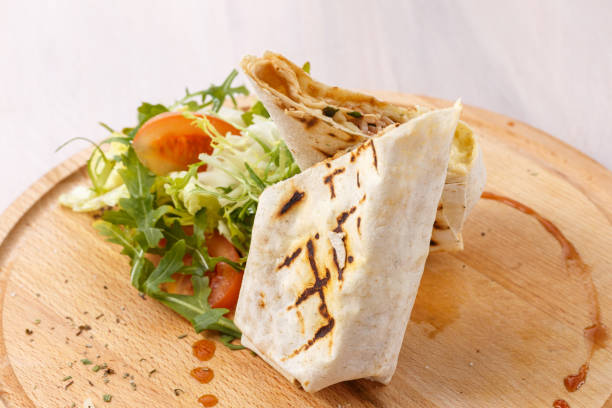 istock pita roll  with salad and spices closeup view 1158424583