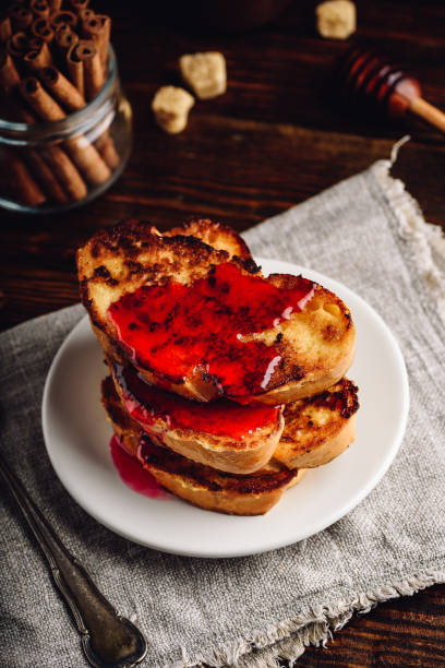 istock Stack of french toasts with berry syrup 1158424934