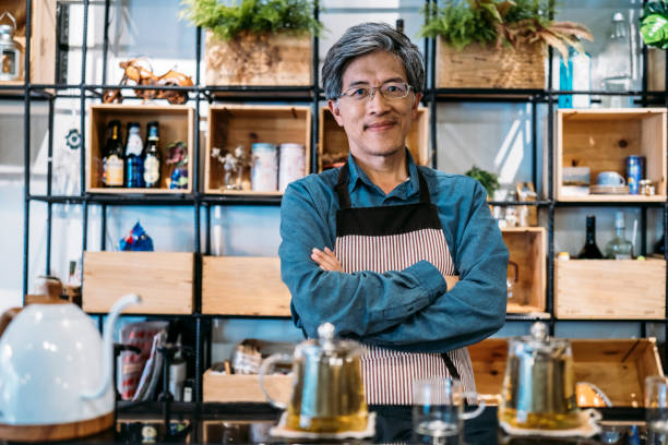 istock Barista standing arms crossed 1158425362