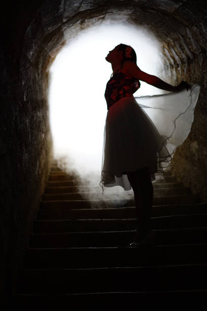 istock Smoke cloud around angel flying out from dark bunker 1158426324