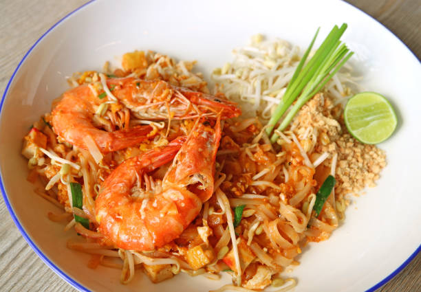Closeup a Plate of Pad Thai or Thai Style Fried Noodle Topped with Prawns
