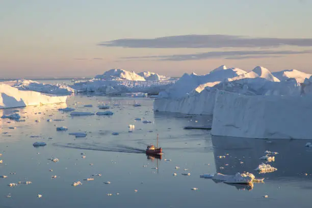 Photo of Red Fishing Boat in Ilulissat Icefjrod