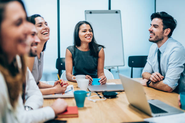 istock Happy group of businesspeople during presentation 1158434884