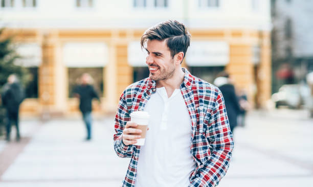 istock Young man with cup of coffee 1158434906