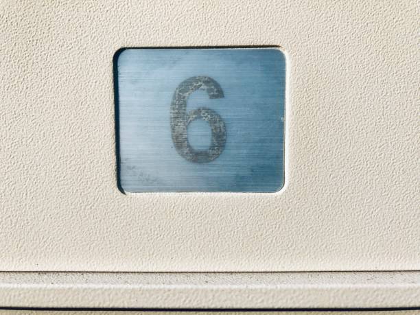 istock close up number six on textured metal surface 1158436428