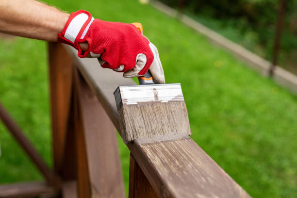 istock restoring wood protective paint on outdoor patio railings 1158441247