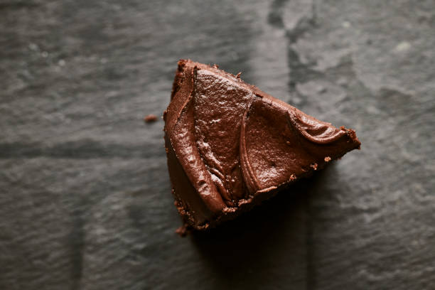 istock Piece of Chocolate cake against a slate background, from above. 1158444056
