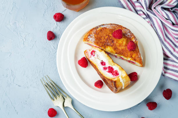 istock Ricotta raspberry stuffed French Toasts with fresh raspberries. 1158444130