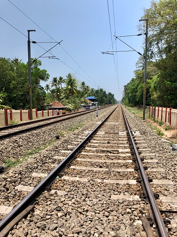 Stock photo of the rail track at Kovalam Railway Station platform, Kovalam, Kerala, India.