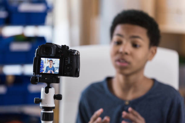 istock Middle school teen makes video for school 1158450556