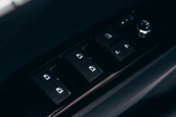 istock Front and back electric windows buttons-lower or close car windows. Leather upholstery, chrome and silver ornaments. Adjustable folding mirrors left and right. 1158456399