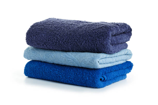 istock Stacked coloful  towels isolated on white background 1158456411