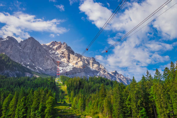 the supporting pylon of the new cable car from lake eibsee to the summit of the mountain zugspitze in bavaria, germany - wetterstein mountains bavaria mountain forest imagens e fotografias de stock