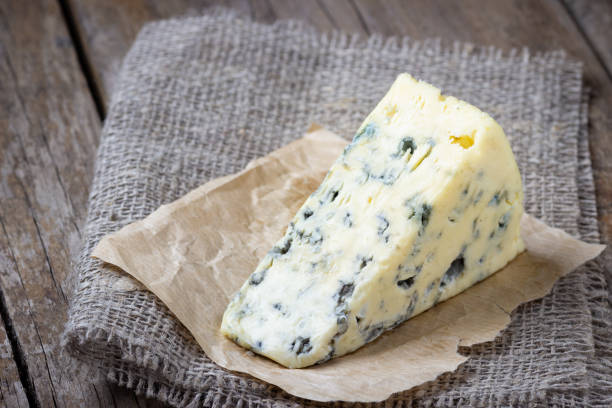 istock Blue cheese on wooden table. 1158459666